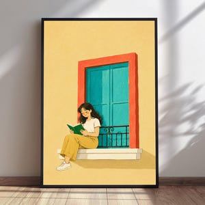 May include: A framed wall art print featuring a person with dark hair sitting on a white window ledge. The person wears a white t-shirt and yellow pants while reading a green book. The window has a bright turquoise frame and a red border.