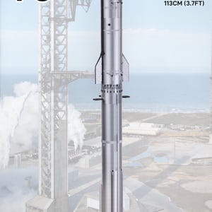 May include: A silver Starship V3 model rocket featuring a black nose cone and base. Text indicates two scales: 1/144 at 86 cm (2.8 ft) and 1/110 at 113 cm (3.7 ft). The rocket has vertical fins and a cylindrical body with detailed paneling.
