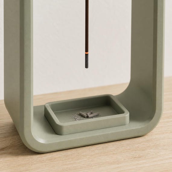 Close-up detail of the fitted ash tray inside a Green EmberLift Incense Stand incense stand