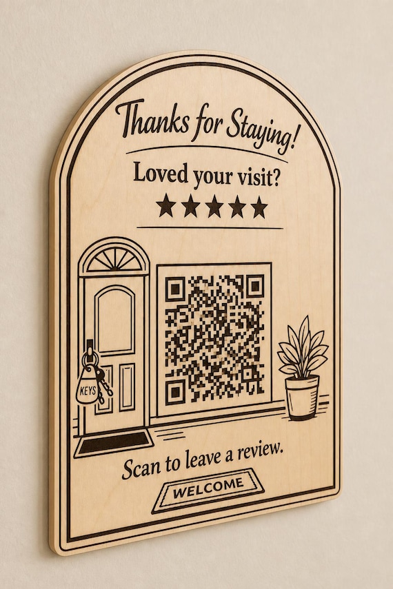 Welcome Key engraved birch guest review sign mounted on a cream wall from a close side angle with a finished sample QR code.