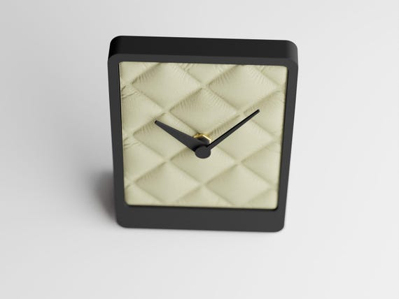 CushionTick Table Clock, front-angle close-up of the Quiltmere table clock and diamond-quilt face
