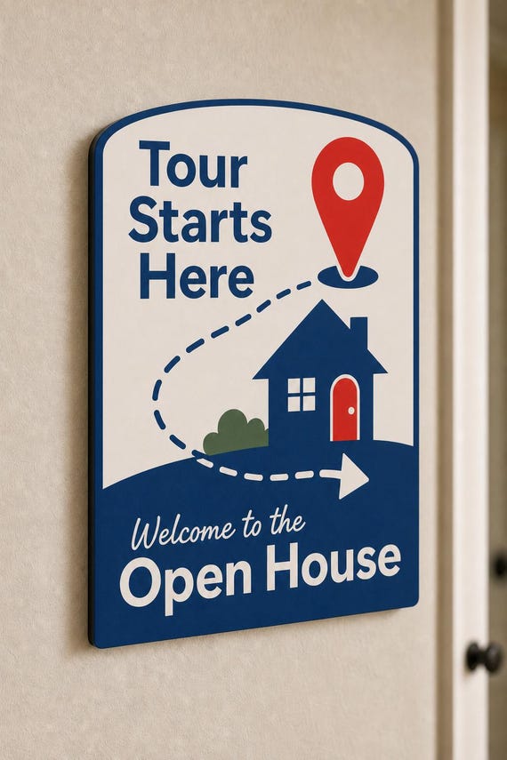 Wayfinder multicolor tour-start sign mounted on a neutral wall from a close side angle.