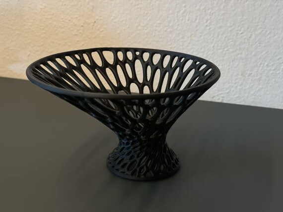 Angled close-up of the Airbloom Pedestal Bowl sculptural bowl in charcoal