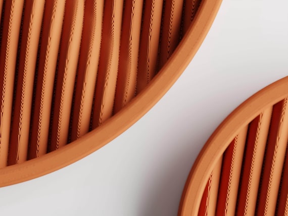 Watersong Tray Set, macro detail of the Ripple Haven tray set's flowing diagonal ripple pattern