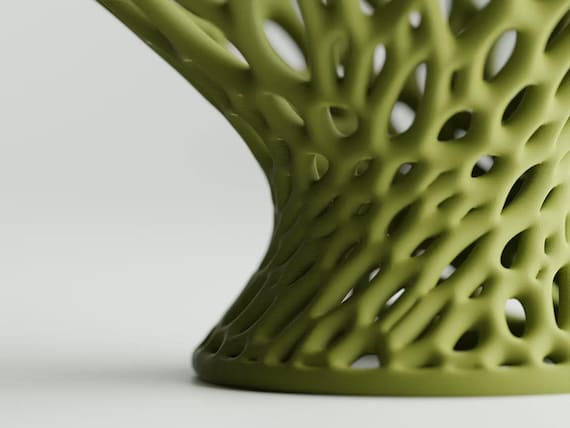 Close-up of the Airbloom Pedestal Bowl pedestal bowl's flowing hourglass base