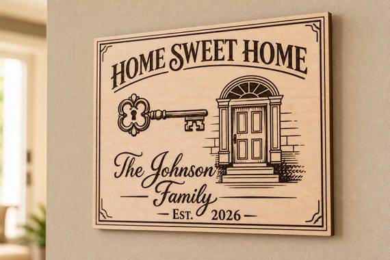 Heritage Home Sweet Home engraved birch sign mounted on a warm wall from a close side angle.