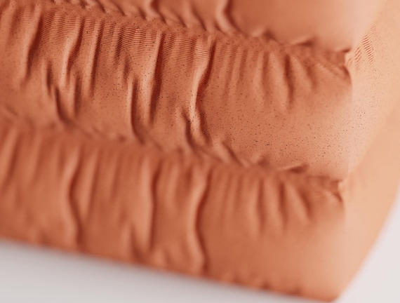Close-up of the Puffridge Pen Cup pen holder showing its gathered fabric-look texture