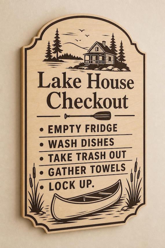 Pinewater engraved birch lake house checkout sign mounted on a warm-beige wall from a close side angle.