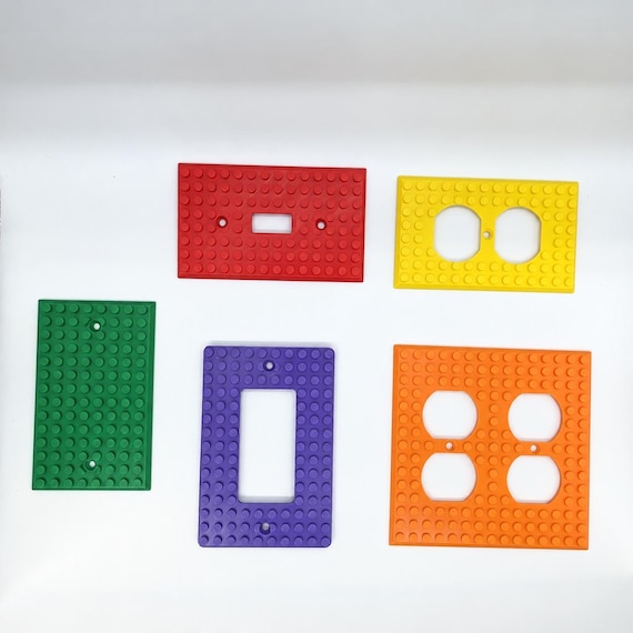Five colorful BuildBoard wall plate configurations displayed on a clean white background