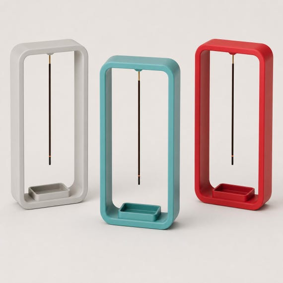 Close-up grouping of EmberLift Incense Stand incense stands in Light Grey, Turquoise, and Red