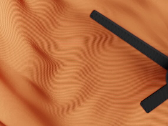 Close-up of the DrapedHour Wall Clock clock's deep flowing surface texture