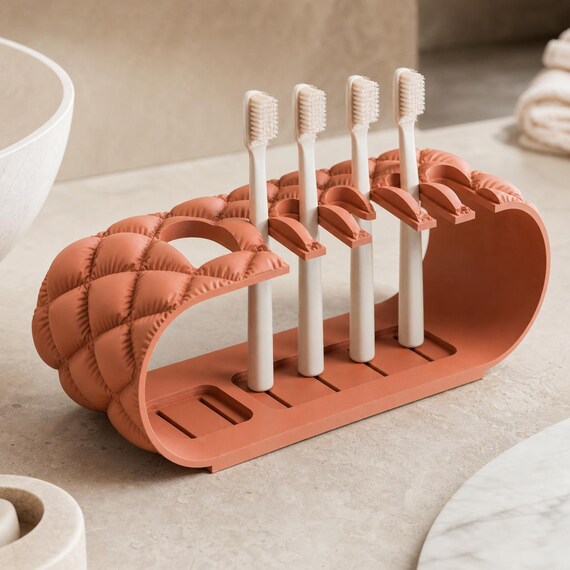 Close-up Terracotta Brushbay Five-Slot Caddy organizer holding one electric and four manual toothbrushes
