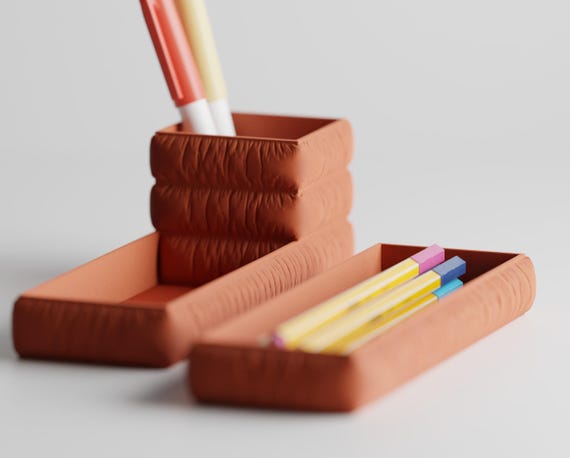 Front-angle close-up of the StudioSwell Organizer Set pen cup and pencil tray set in Terracotta