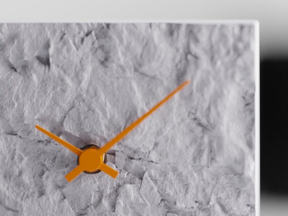 QuarryHour Table Clock, detail view of the Stonewake clock face with contrasting Orange hands