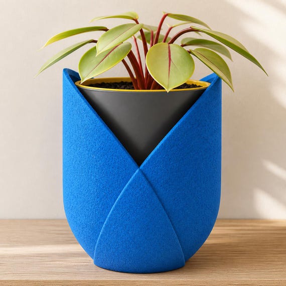 Close-up of the LayerMoon Planter planter in Cobalt Blue, Dark Grey, and Sunflower Yellow