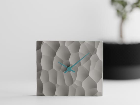 PrismHearth Table Clock, glacier Current Facetfield clock shown fully assembled in a realistic shelf setting