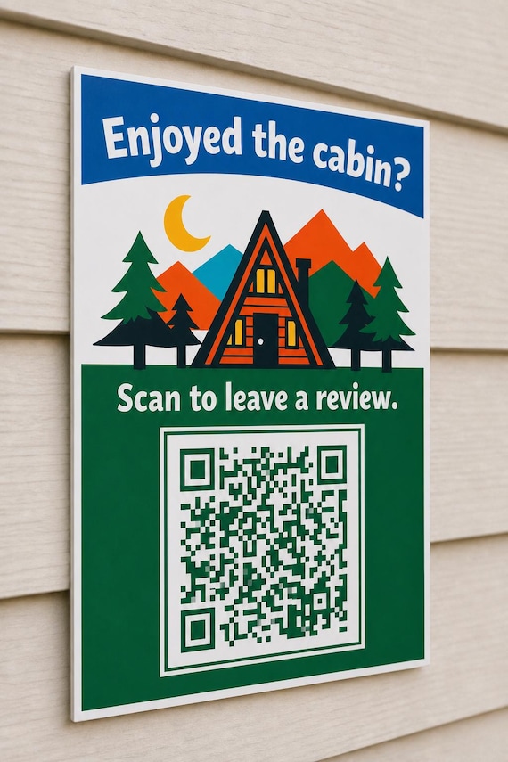 A-Frame Haven multicolor cabin review sign mounted on a neutral wall from a close side angle with a finished sample QR code.