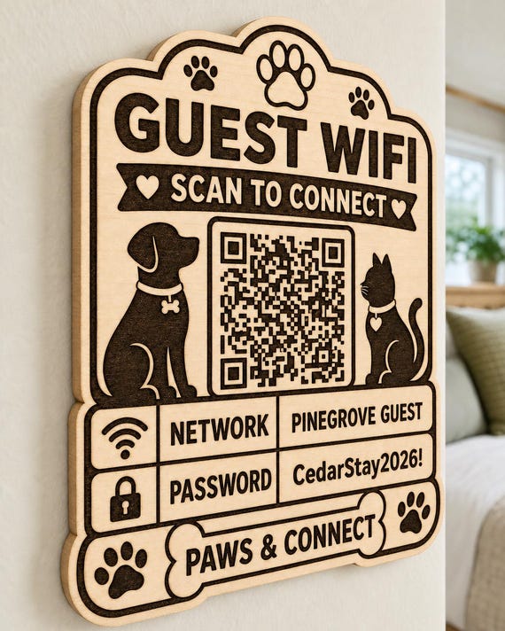 Paws & Connect Guest WiFi Sign engraved birch sign mounted on a realistic neutral interior wall from a close side angle in natural birch and dark engraving, showing the QR code and guest network details.