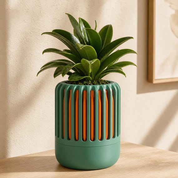 BreezeCage Orchid Pot, close-up of the Airloom orchid planter in Mistletoe Green and Pumpkin Orange Forest Ember colors