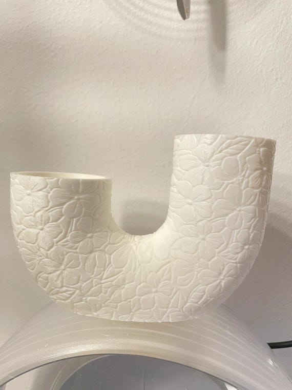 Angled lifestyle view of the Garden Blossoms TwinBloom Floral Vase showing its connected U-shaped silhouette