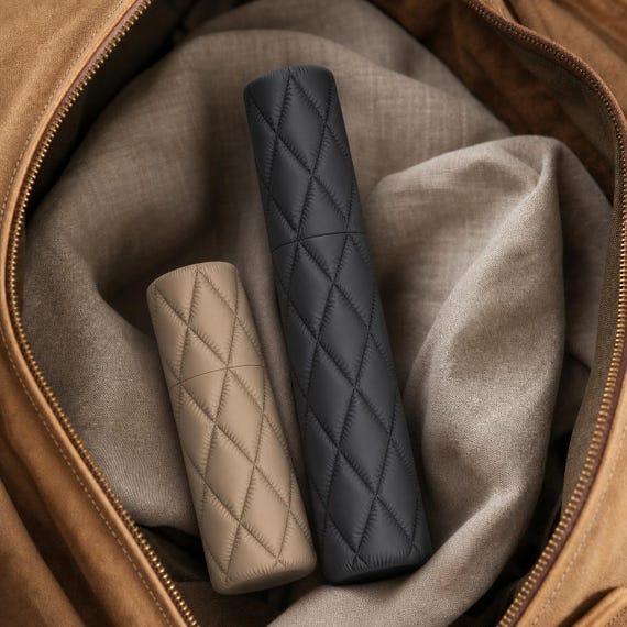 Wayfarer Quilt Case Collection, close-up of complete Charcoal and Desert Tan Cloudquilt cases packed in a travel bag