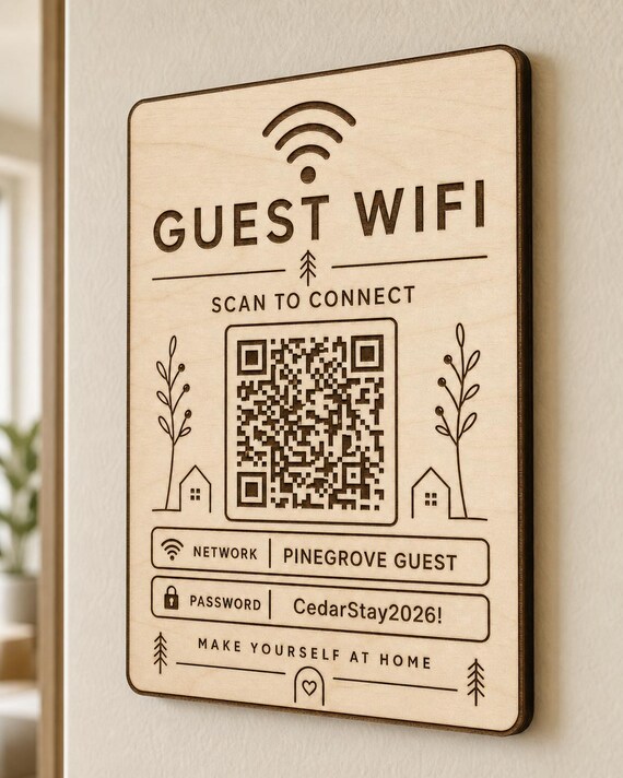 Hearthline Connect Guest WiFi Sign engraved birch sign mounted on a realistic neutral interior wall from a close side angle in natural birch and dark engraving, showing the QR code and guest network details.