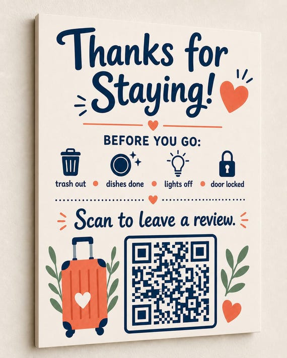 CoralKey navy and coral review sign mounted on a warm-white wall from a close side angle with a finished sample QR code.