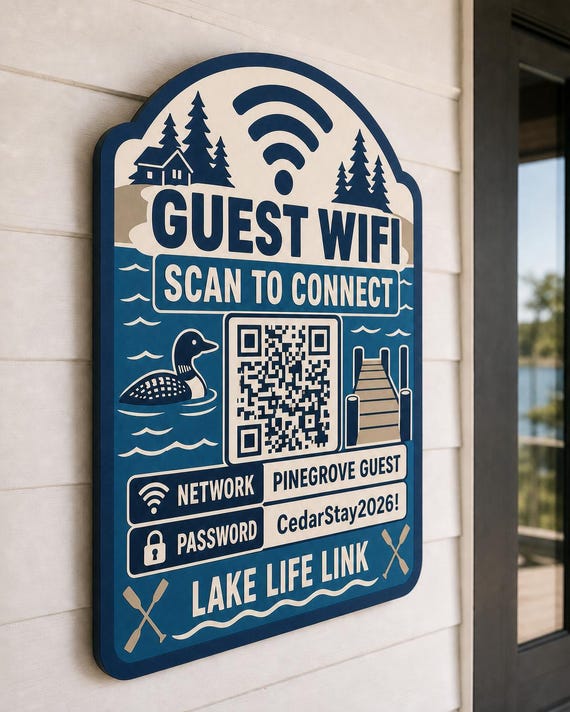 Lake Life Link Guest WiFi Sign textured multicolor sign mounted on a realistic neutral interior wall from a close side angle in navy, lake blue, taupe, and cream, showing the QR code and guest network details.