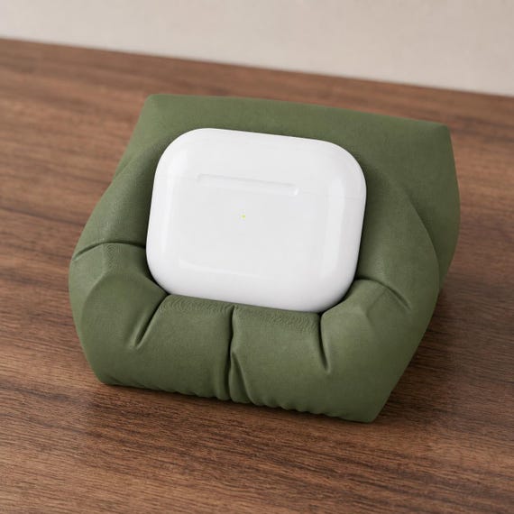 Dark Green Snugseat Earbud Dock standard earbud case holder from an elevated angle
