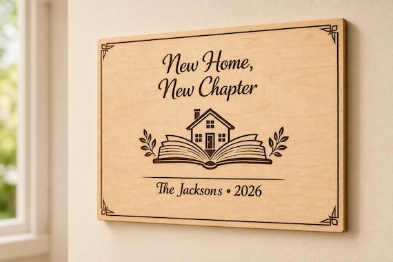 New Chapter engraved birch family sign mounted on a neutral wall from a close side angle.