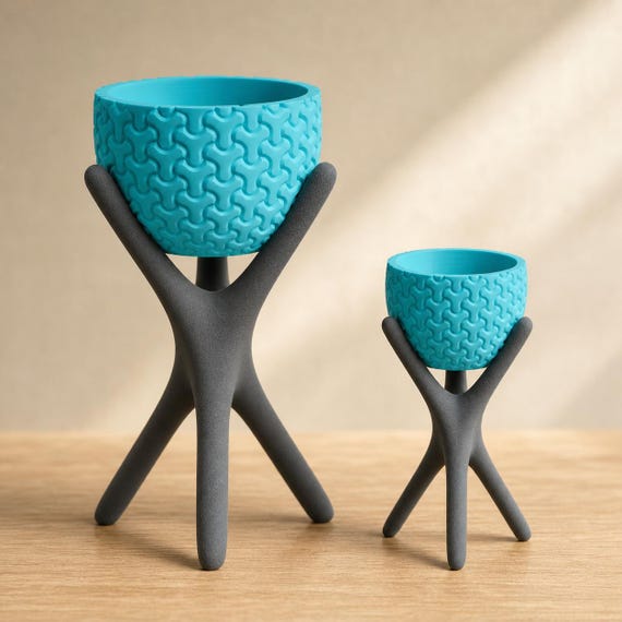 Close-up comparison of Large and Small HearthLift Tripod Planter planters in Dark Grey and Turquoise