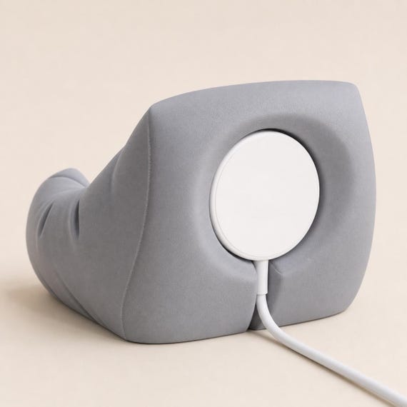 Rear view of Nardo Gray Snugseat Earbud Dock charger-ready stand with charging puck and cable path