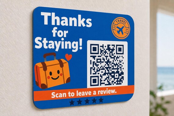 JetSet Thanks multicolor landscape travel review sign mounted on a light wall from a close side angle with a finished sample QR code.