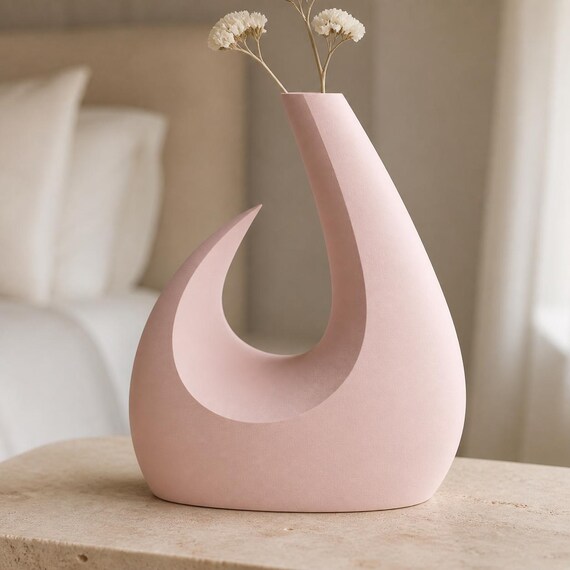 MoonGate Statement Vase, close-up lifestyle view of the Solstice Arc vase in Sakura Pink with dried white stems