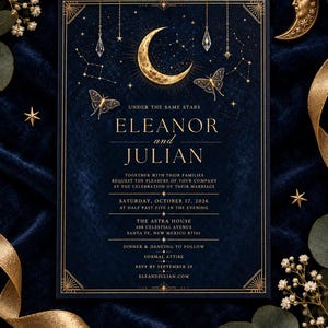 May include: A rectangular wedding invitation card in deep navy blue with gold foil accents. It features a crescent moon, butterflies, and constellations. The text reads: Under the same stars, Eleanor and Julian, together with their families request the pleasure of your company at the celebration of their marriage, Saturday, October 17, 2026, at half past five in the evening, The Astra House, 408 Celestial Avenue, Santa Fe, New Mexico 87501, dinner and dancing to follow, formal attire, RSVP by September 19, eleandjulian.com.