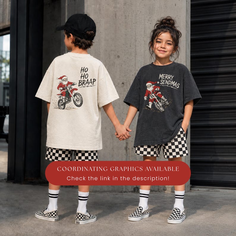May include: A beige t-shirt with a graphic of Santa Claus on a dirt bike and the text HO HO BRAAP, and a charcoal gray t-shirt with a graphic of Santa Claus on a dirt bike and the text MERRY SENDMAS, both paired with black and white checkered shorts.