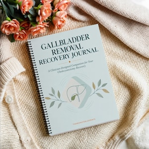 May include: A spiral-bound Gallbladder Removal Recovery Journal with a light blue cover. The text reads Gallbladder Removal Recovery Journal, A Clinician-Designed Companion for Your Cholecystectomy Recovery, and Themednoteblueprints. It features a line drawing of a gallbladder with leaf illustrations.