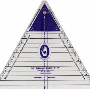 May include: A clear acrylic 60-degree triangle ruler for quilting, featuring dark blue markings, horizontal strip width guidelines from 3 to 9 inches, seam allowance indicators, and a central logo with a hand and heart icon, labeled 60 Triangle-Ruler 3-9.