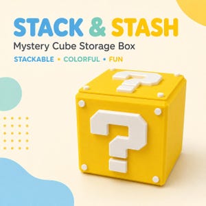 May include: A yellow cube-shaped storage box featuring a white question mark on the top and front faces. The text STACK & STASH Mystery Cube Storage Box STACKABLE • COLORFUL • FUN is displayed above the box in blue, teal, and yellow lettering.