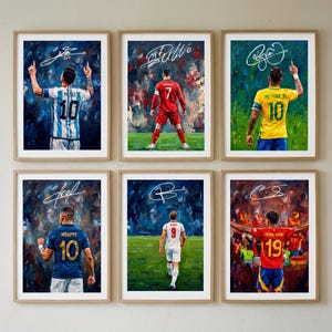 May include: A set of six framed art prints featuring soccer players from behind, each wearing a numbered jersey and displaying a signature. The collection includes Messi in blue and white, Ronaldo in red, Neymar in yellow, Mbappe in blue, Kane in white, and a player in red.
