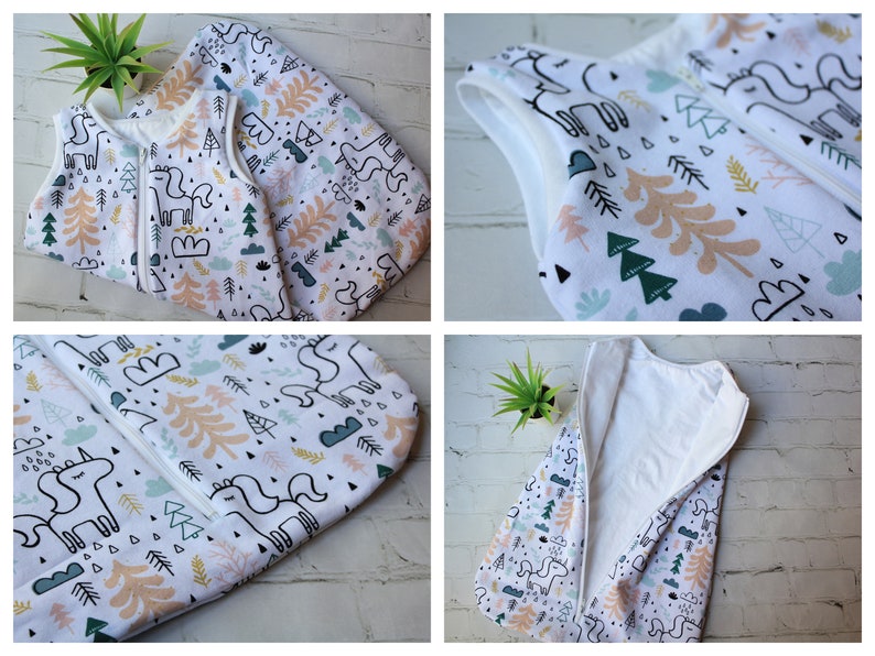 May include: White baby sleep sack with a whimsical pattern of unicorns, trees, and clouds in pastel colors. The sleep sack has a full-length zipper and a sleeveless design. The fabric appears soft and comfortable, suitable for a baby's delicate skin.