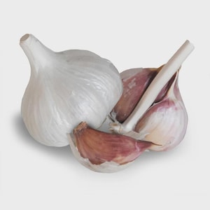 May include: A whole white garlic bulb positioned next to a partially separated garlic bulb with visible purple-tinged cloves. The cloves have a papery, thin skin texture, and the bulb structure shows distinct segments and a central stem.