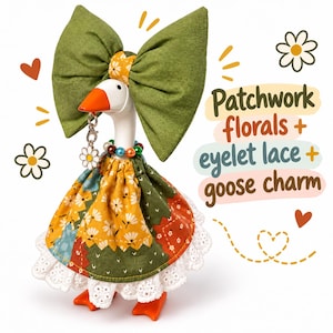 May include: A white goose figurine wearing a large olive green fabric bow, a multi-colored bead necklace, and a patchwork dress with floral patterns and a white eyelet lace trim. A silver daisy charm hangs from the orange beak. Text reads: Patchwork florals + eyelet lace + goose charm.