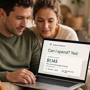 May include: A laptop screen displaying a Budget Dashboard interface with the text Can I spend? Yes! and an Available to spend amount of $1,143. The screen shows 83% of this month's budget remaining, with bills paid at $820 and spent this month at $307.