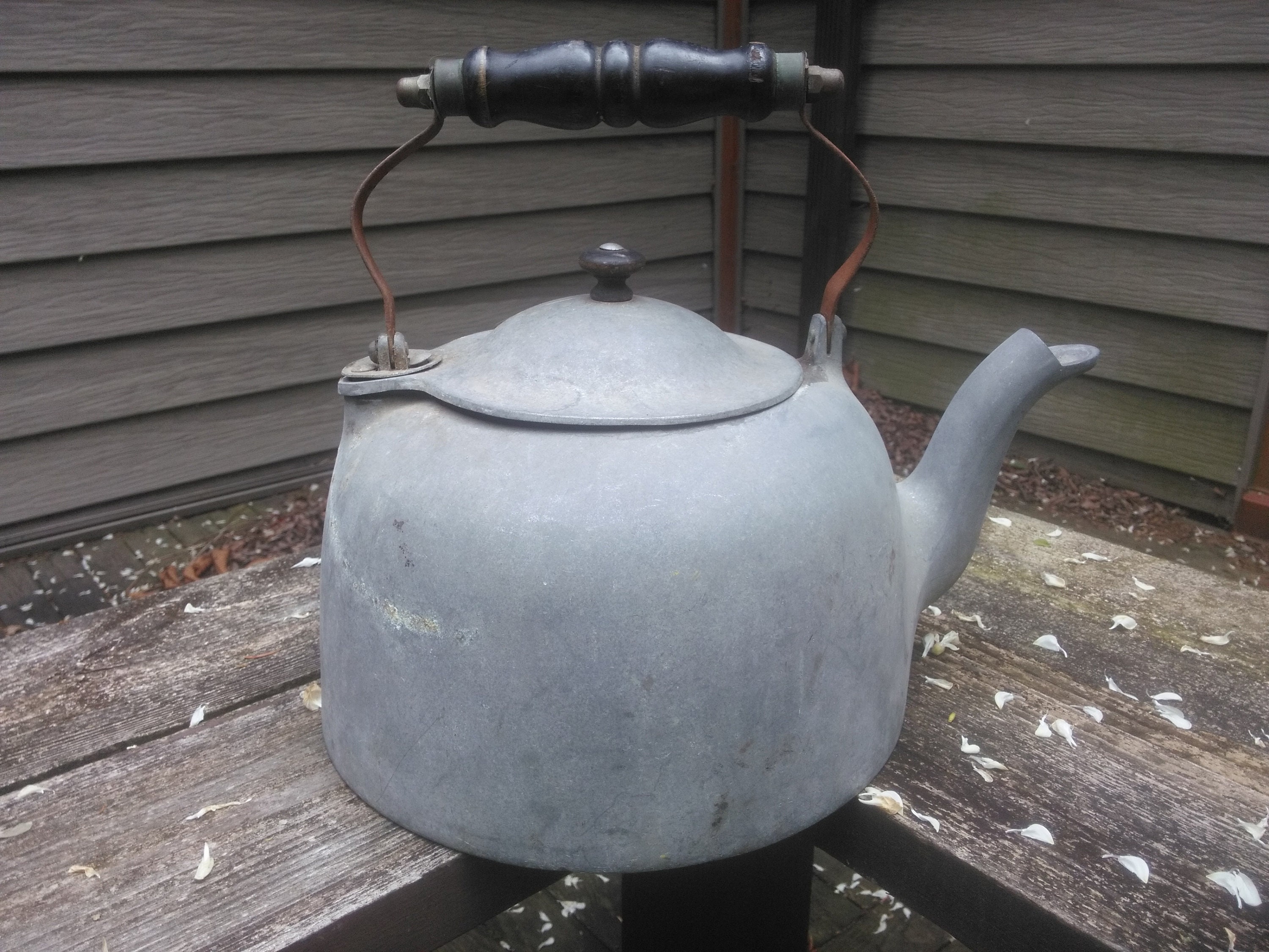 Vintage large aluminum tea pot kettle stove top isolated Stock