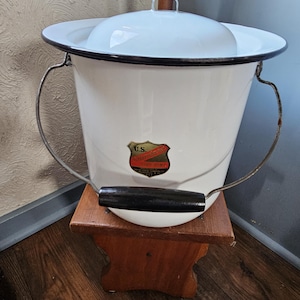 May include: A set of three ceramic mugs with a speckled, matte finish. The mugs are in shades of cream, light gray, and dark gray. Each mug has a simple, minimalist design, perfect for coffee or tea.