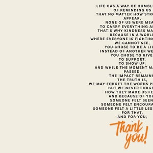 May include: A cream-coloured card featuring black text that reads: Life has a way of humbling us. Of reminding us that no matter how strong we appear, none of us were meant to carry everything alone. That's why kindness matters. Thank you in orange.