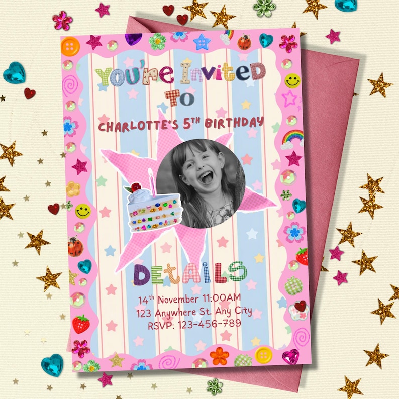 A colorful birthday invitation sits on a surface sprinkled with gold star confetti and shiny heart decorations. The card has a bright pink border covered in playful stickers like smiley faces, strawberries, rainbows, and flowers. A black‑and‑white photo of a smiling child appears inside a pink star, with a cute birthday cake illustration below. Soft pastel blue‑and‑white stripes create a cheerful, whimsical backdrop.