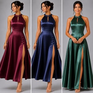 May include: A sleeveless satin floor-length dress featuring a high halter neckline with a keyhole cutout, a fitted waist, and a flared skirt with a high side slit accented by a vertical row of decorative buttons, available in burgundy, navy, and emerald.