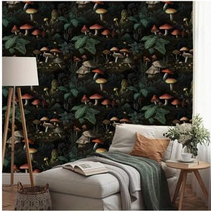May include: A dark green and black wallpaper with a repeating pattern of red and brown mushrooms. The wallpaper is shown in a room with a white couch and a wooden side table.